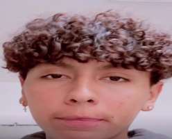 He has piercing in both ears and mostly maintains curly hair.